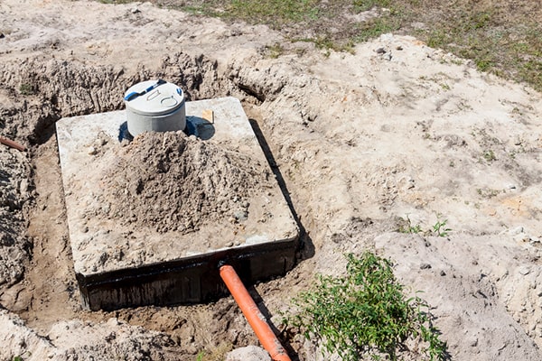 during septic tank pumping, a professional will use a vacuum truck to remove sludge and scum from the tank